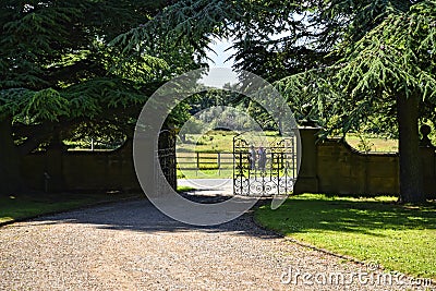 Exit to the deer park in Garden at Beautiful Country House near Leeds West Yorkshire that is not National Trust Editorial Stock Photo