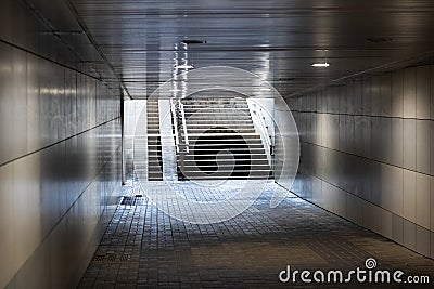 Exit tunnel underpass and stairs in sunlight Stock Photo