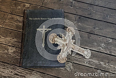 Exorcism book on wooden floor Cartoon Illustration