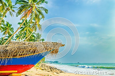 Exotic beach with colorful boat, tall palm trees Stock Photo