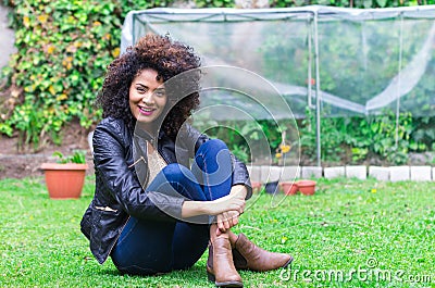 Exotic beautiful young girl relaxing in the garden Stock Photo