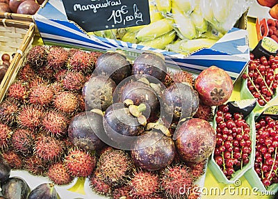 Exotic fruits. Market stall with variety of organic fruits. Colorful fruits in the marketplace. Bright summer background. Healthy Editorial Stock Photo