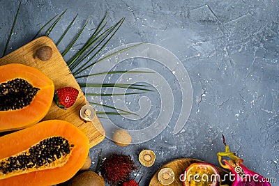 Exotic fruits on wooden chopping board Stock Photo