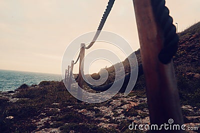 Exotic Jungle Fence Between Sea and Walking Path Stock Photo