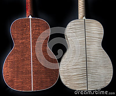 Exotic, rare and figured wood on the backs of acoustic guitars - flamed maple figured tiger mahogany Stock Photo