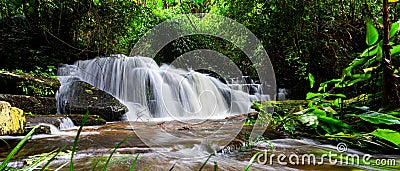 Exotic waterfall and lake landscape panoramic beautiful waterfall in rainforest at Mundang waterfall national park, Stock Photo