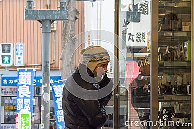 Expat foreigner looking at the old analog film cameras on sale in Osaka, Japan Editorial Stock Photo