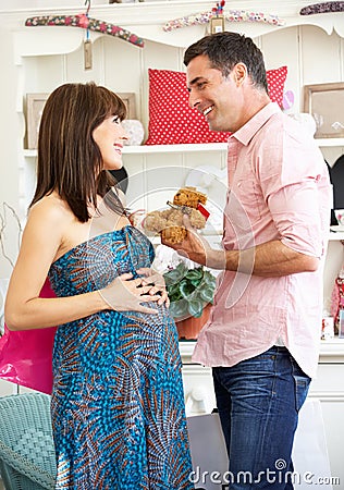 Expectant couple out shopping Stock Photo