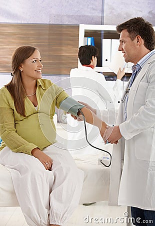 Expectant woman at doctor Stock Photo