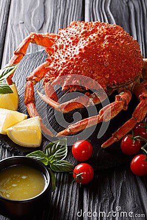 Expensive food: cooked whole crab spider with lemon and melted b Stock Photo