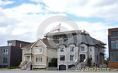 Expensive houses and the building construction behind Stock Photo
