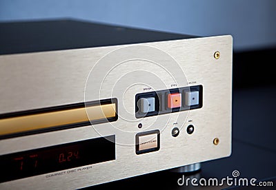 Expensive Stereo CD Player with Golden Front Panel Plays Music on Compact Disk Stock Photo