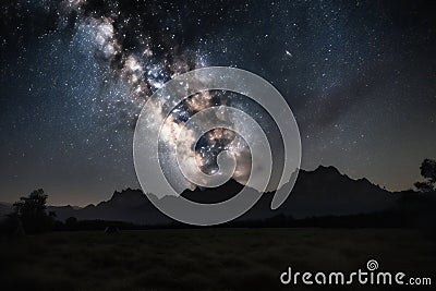 Enchanting Nighttime Vista: Milky Way and Mountain Glow (AI Generated) Stock Photo
