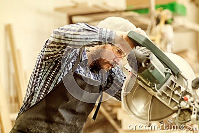 Experienced carpenter in workshop Stock Photo