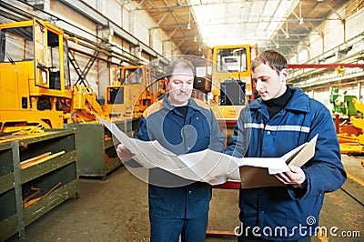 Experienced industrial assembler workers Stock Photo