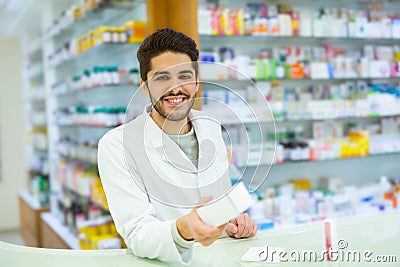 Experienced pharmacist counseling female customer in pharmacy Stock Photo