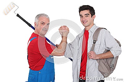 Experienced tradesman with new apprentice Stock Photo