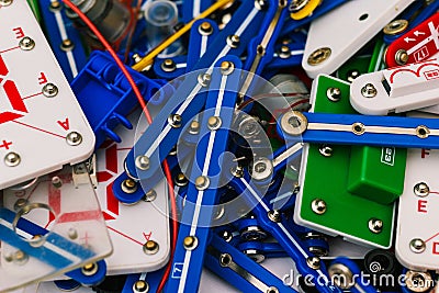 Experiments with electricity for children. Constructor with microchips. Colored parts for the assembly of electrical circuits. The Stock Photo