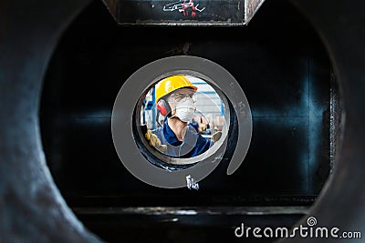 Expert checking the quality of manufactured boilers Stock Photo