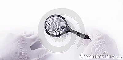 Expert through a magnifying glass looking at a fingerprint Stock Photo