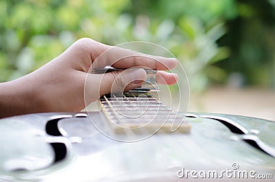 Expert Musician plays a Dobro Guitar Stock Photo