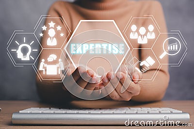 Expertise, expert, consulting, knowledge, team, advice, trust and research concept, Business person hand holding expertise icon on Stock Photo