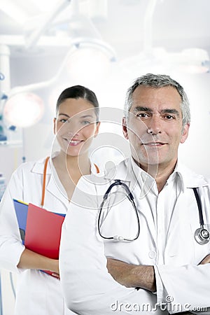 Expertise gray hair doctor beautiful nurse Stock Photo