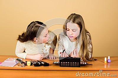 Experts in colour. Adorable small makeup artists using colour cosmetics. Cute little girls applying colour eyeshadow Stock Photo