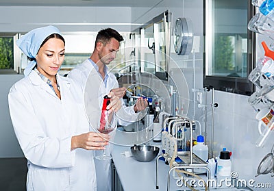 Experts making tests in winery laboratory Stock Photo