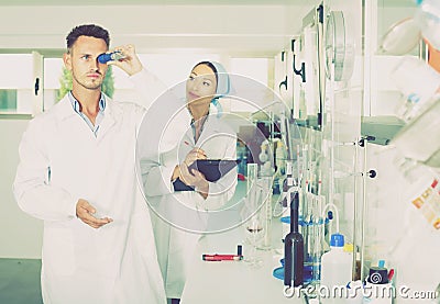 Experts making tests in winery laboratory Stock Photo