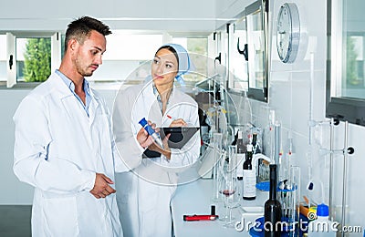 Experts making tests in winery laboratory Stock Photo