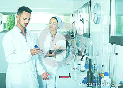 Experts making tests in winery laboratory Stock Photo