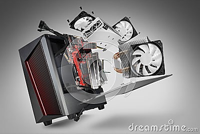 Exploded view of a modern computer. hardware components mainboard cpu processor graphic card RAM cables and cooling fan flying out Stock Photo