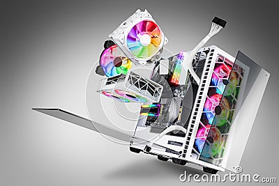 Exploded view of white gaming pc computer with glass windows and rainbow rgb LED lights. Flying hardware components abstract Stock Photo