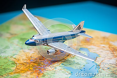 Exploration theme Close up of a map with a model airplane Stock Photo