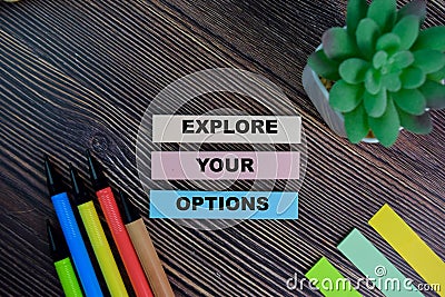 Explore Your Options write on sticky notes isolated on Wooden Table Stock Photo