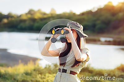 Explorer Girl with Camouflage Hat and Binoculars Stock Photo