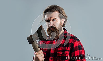 exploring tools. male casual fashion style. handsome hipster with axe. logger or axeman concept Stock Photo