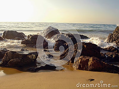 explosion of the waves on the rocks at sunset on the mediterranean sea Stock Photo