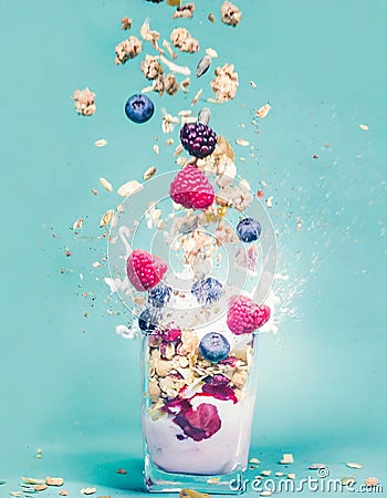 Explosion of yoghurt, berries, and granola Stock Photo