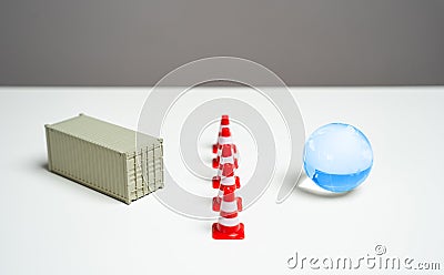 Export restrictions. The shipping container is separated from the world by traffic cones. Stock Photo