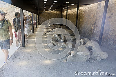 Exposed dead people covered with volcanic ash in the Pompeii museum Editorial Stock Photo