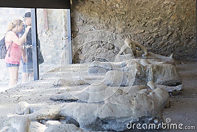 Exposed dead people covered with volcanic ash in the Pompeii museum Stock Photo