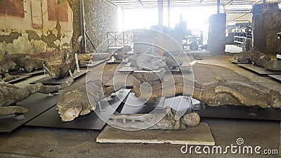 Exposed dead people covered with volcanic ash in the Pompeii museum Editorial Stock Photo