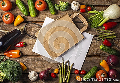 Exposition of fresh organic vegetables on wooden table. tomato, pepper, broccoli, onion, garlic, cucumber, eggplant, black Eyed P Stock Photo