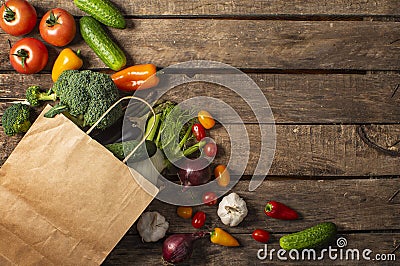 Exposition of fresh organic vegetables on wooden table. tomato, pepper, broccoli, onion, garlic, cucumber, eggplant, black Eyed P Stock Photo