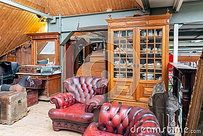 Exposition of vintage furniture at Dutch flea market Editorial Stock Photo