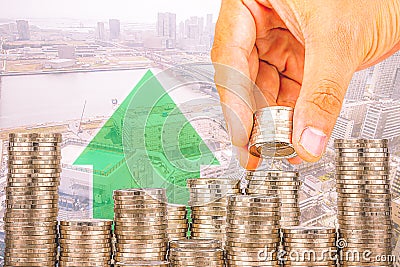 Exposure of Finance and Saving money banking concept,Hope of investor concept,Male hand putting money coin like stack growing busi Stock Photo