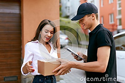 Express Delivery Service. Courier Delivering Package To Woman Stock Photo