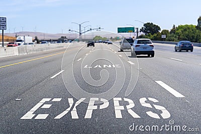 Express Lane marking on the freeway; San Francisco Bay Area, California; Express lanes help manage lane capacity by allowing Editorial Stock Photo